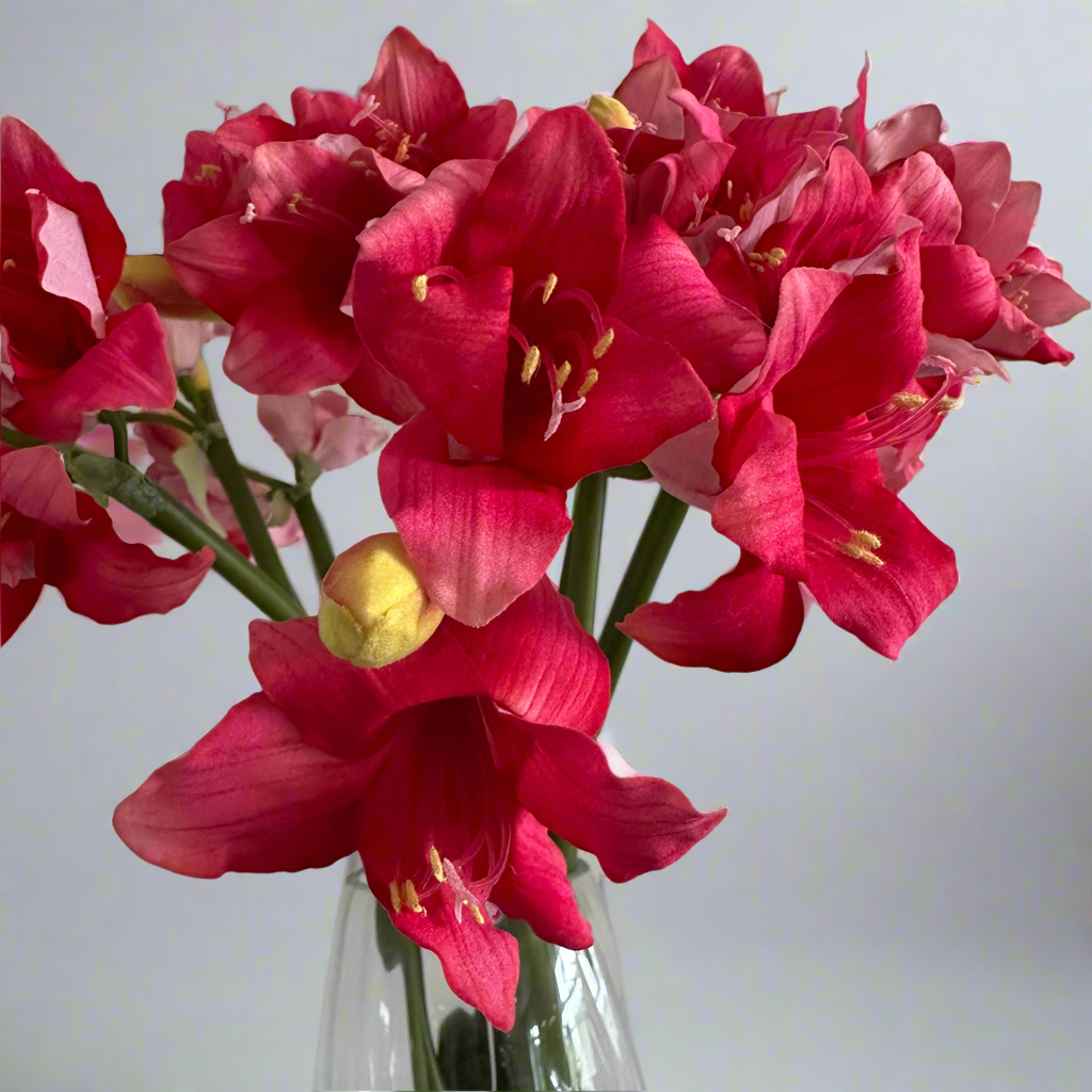 Close-up of artificial pink amaryllis flower showing detailed petals and central stamen