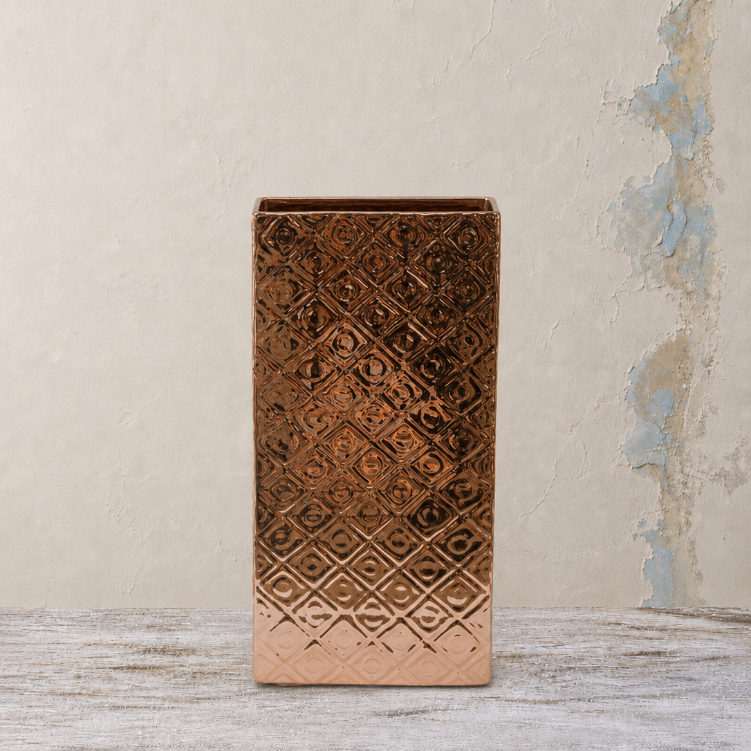Tall rectangular copper pot with an embossed geometric textured design.