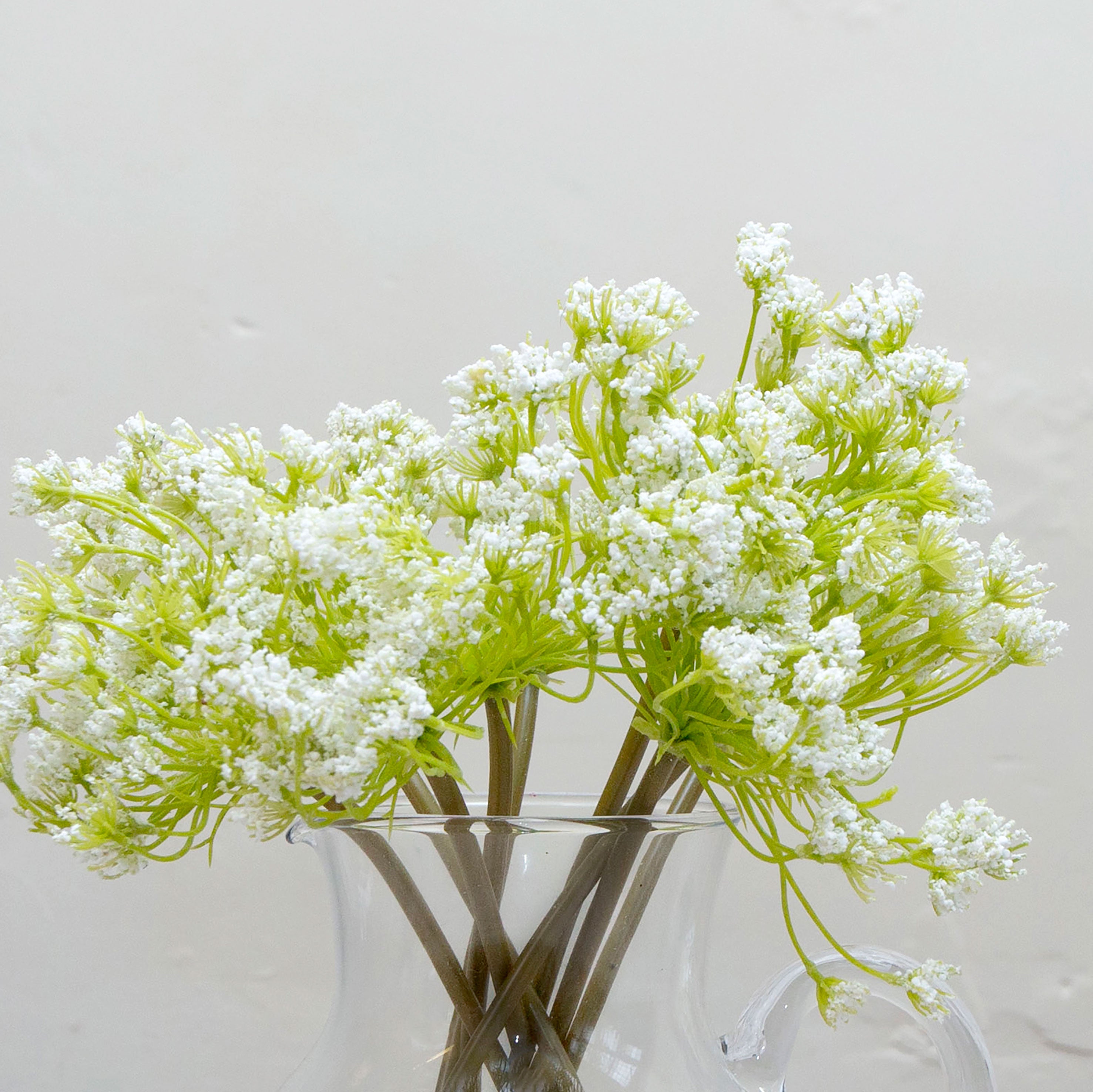 Close-up of artificial cow parsley (Queen Anne’s lace) flowers showing fine white clustered detail.