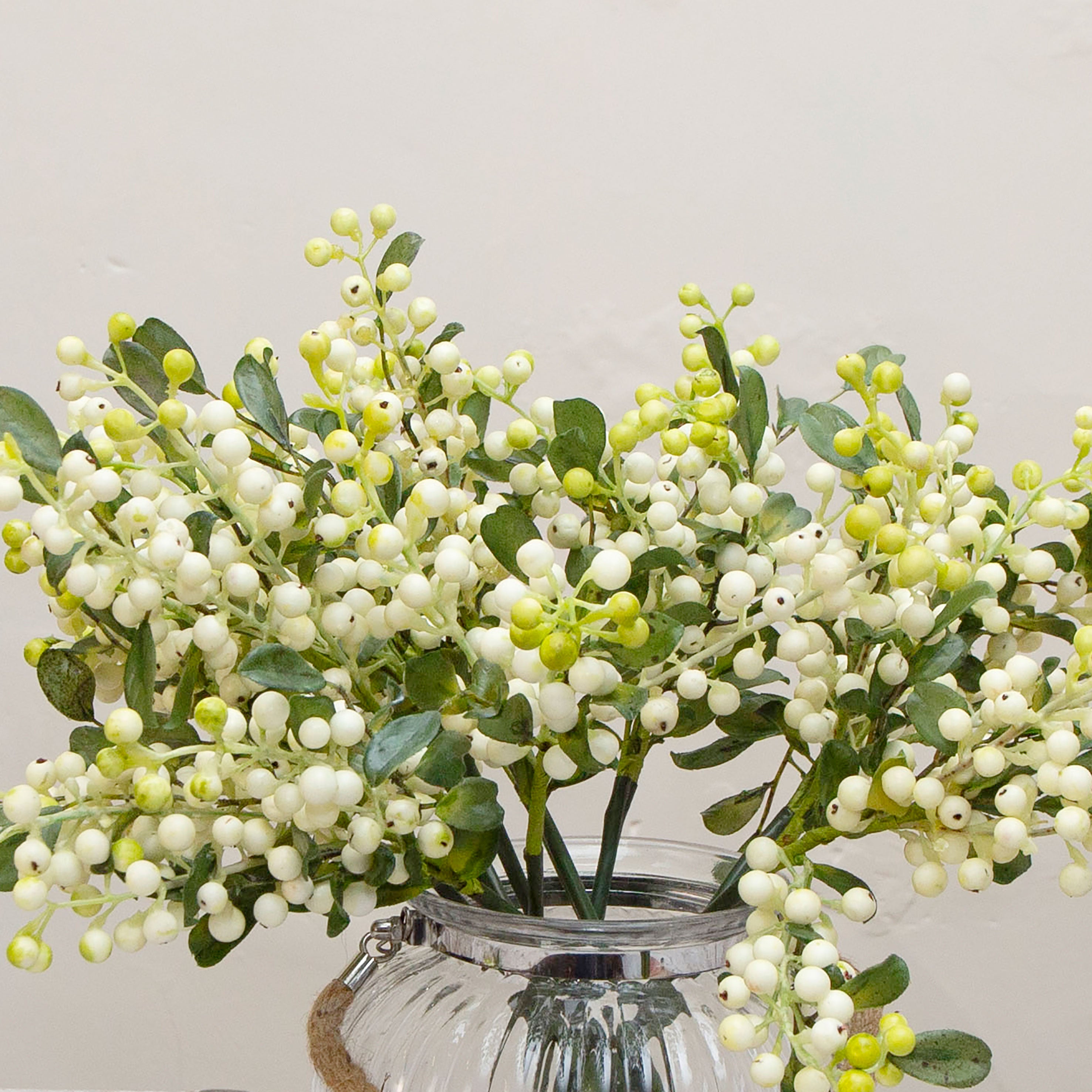 Close-up of artificial berry stems, showing creamy white berries with soft green accents, subtle colour variation, textured stems and detailed foliage for a natural finish