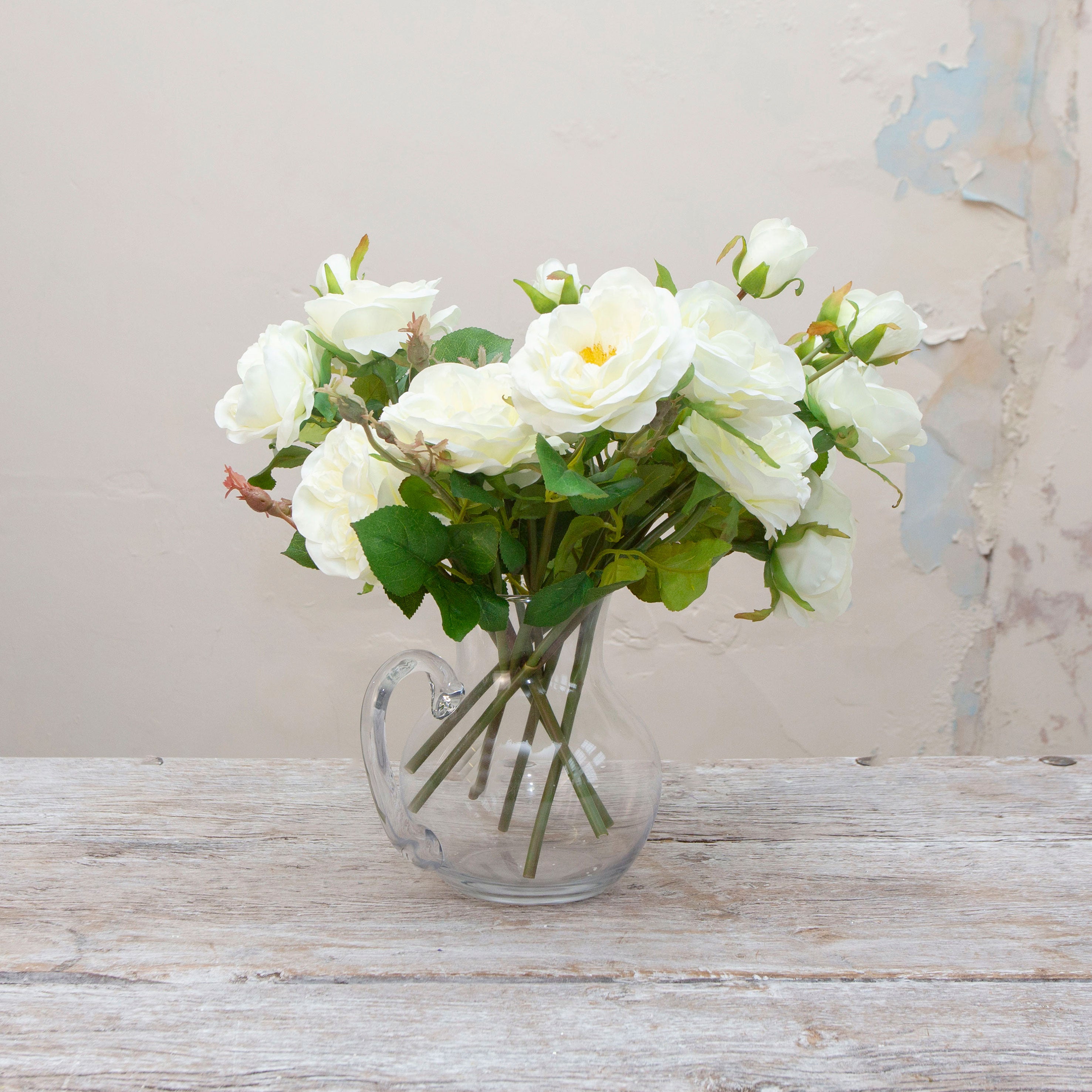 Artificial bridal white old English rose stems displayed in vase