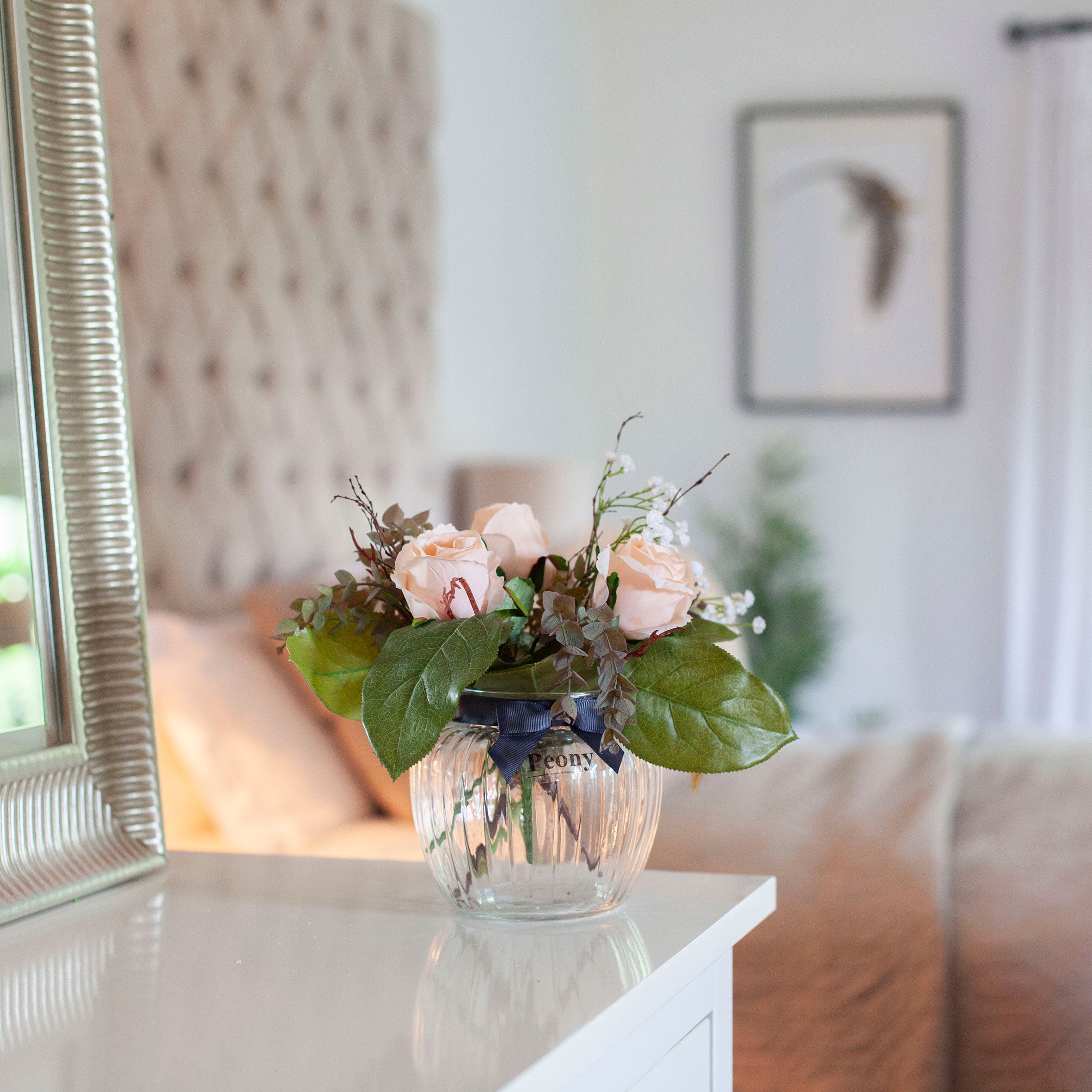 Artificial Peach Roses, Mini Eucalyptus & Gypsophila in Optic Jar Vase Gift Set, styled on a white console table in a softly lit neutral home interior.