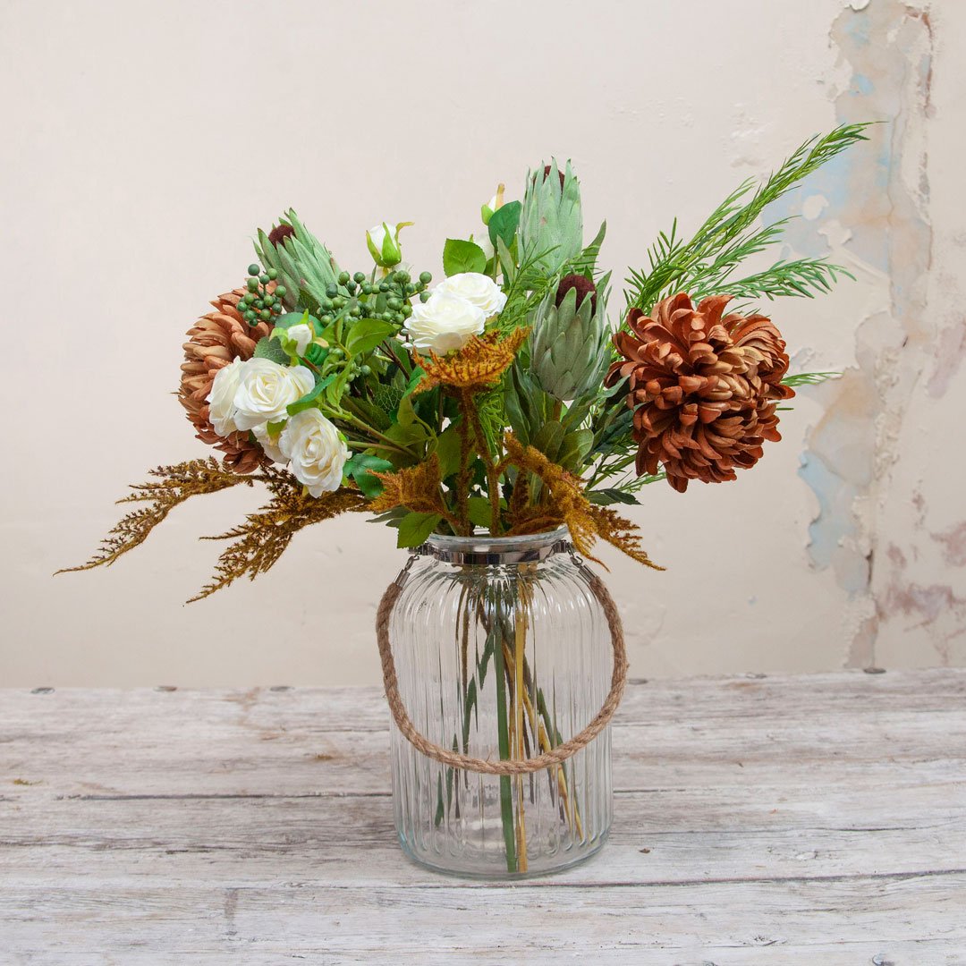 Orange Chrysanthemums and Foliage in a Large Rope Lantern Vase Peony