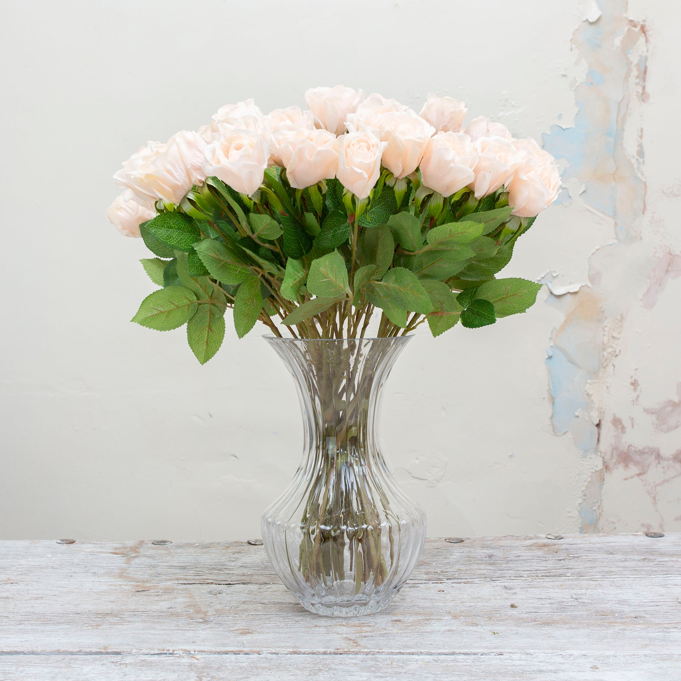 Artificial Apricot Real Touch Rose with Foliage on a Long Stem in a glass vase