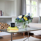 Artificial blue and yellow floral bowl arrangement with Roses, Hydrangeas and Tulips
