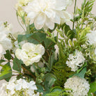 Artificial white and greenery faux flower arrangement with hydrangea, dahlia, snowball blooms and ferns in a glass Hampton vase