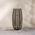 Medium smoked ridged glass vase with a tall curved silhouette.