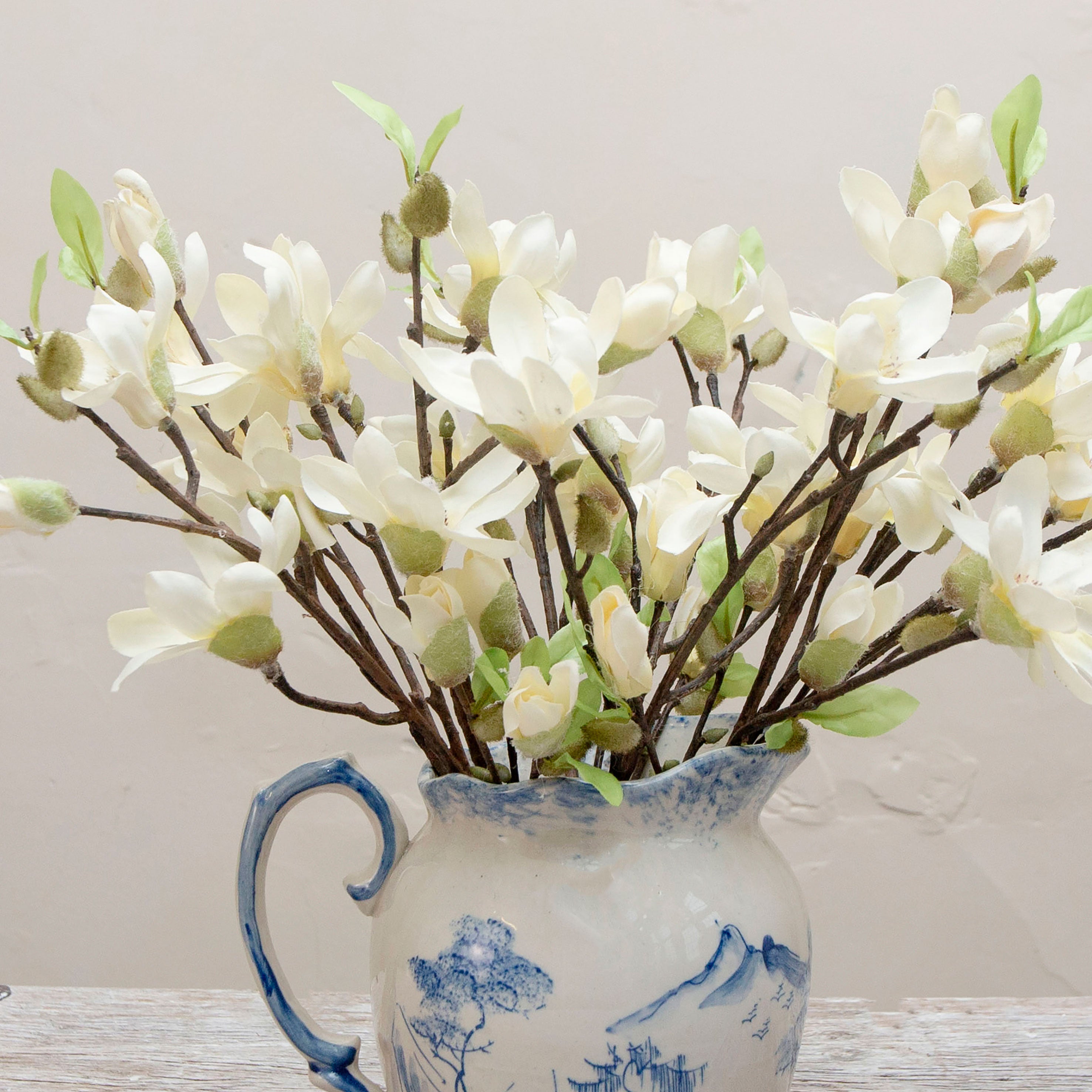 Close-up of artificial bridal white magnolia blossom flowers showing open petals and central detail