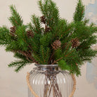 Close up artificial Pine Cone Stem with realistic green pine foliage and brown pine cones