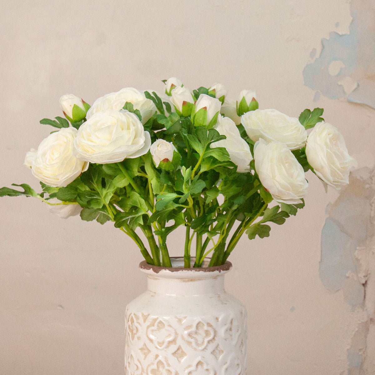 Close up in artificial Ranunculus Spray Stem with white ranunculus flowers, buds and green foliage