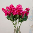 Close-up of artificial bright pink conehead hydrangea showing dense clustered blooms and rich colour  details of stem