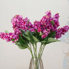 Close-up of artificial purple-pink conehead hydrangea showing dense clustered blooms and rich colour detail.