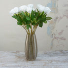 Artificial Apricot Real Touch Rose with Foliage on a Long Stem  displayed in a glass vase