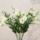 Close-up of artificial white lisianthus flowers showing soft petals and gentle colour variation.