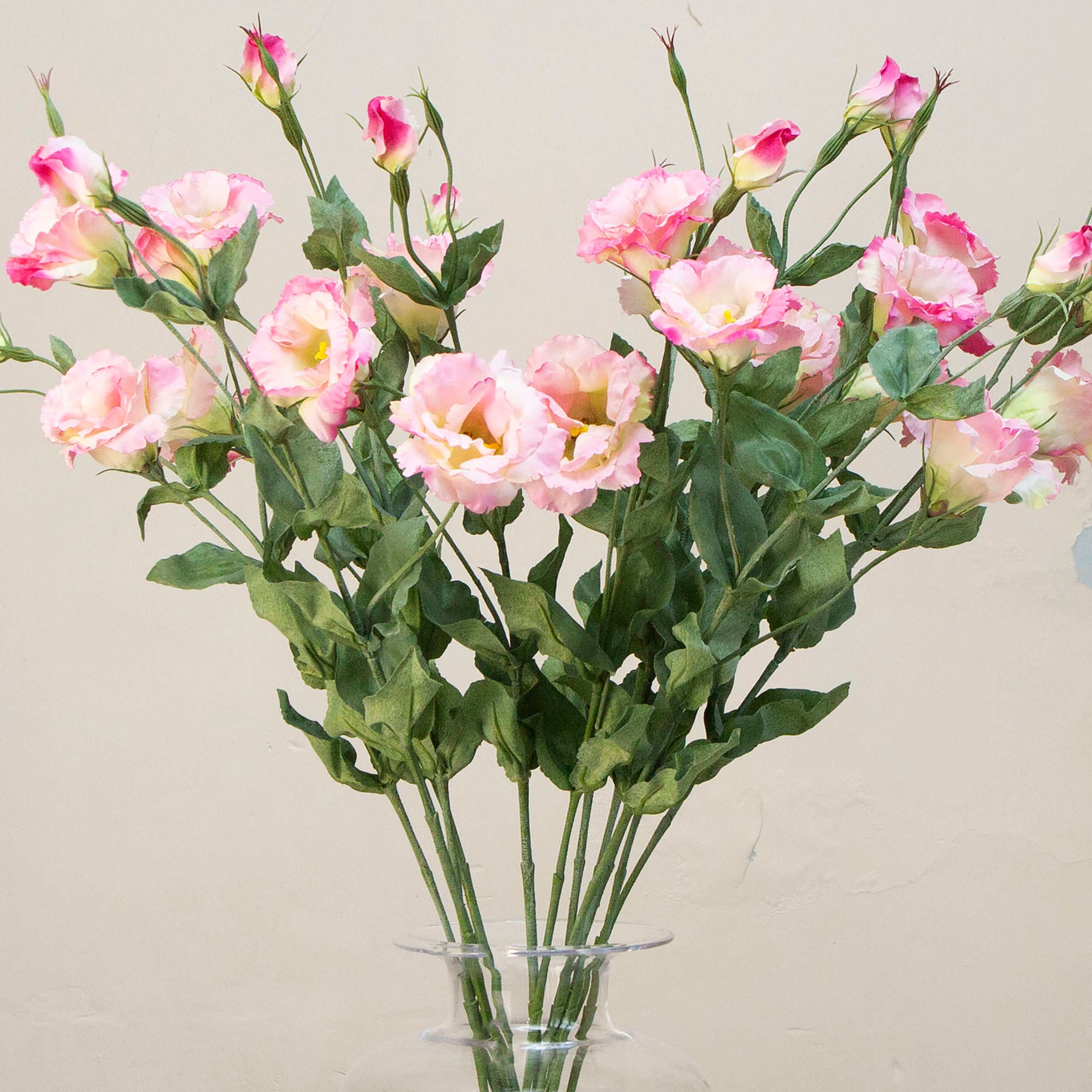 Close-up of artificial pale pink lisianthus flowers showing soft petals and gentle colour variation.