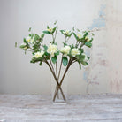Artificial bridal white rhododendron stems displayed together in a vase for styling purposes.
