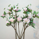 Close-up of artificial pink and white rhododendron flowers showing layered petals and gentle colour variation.