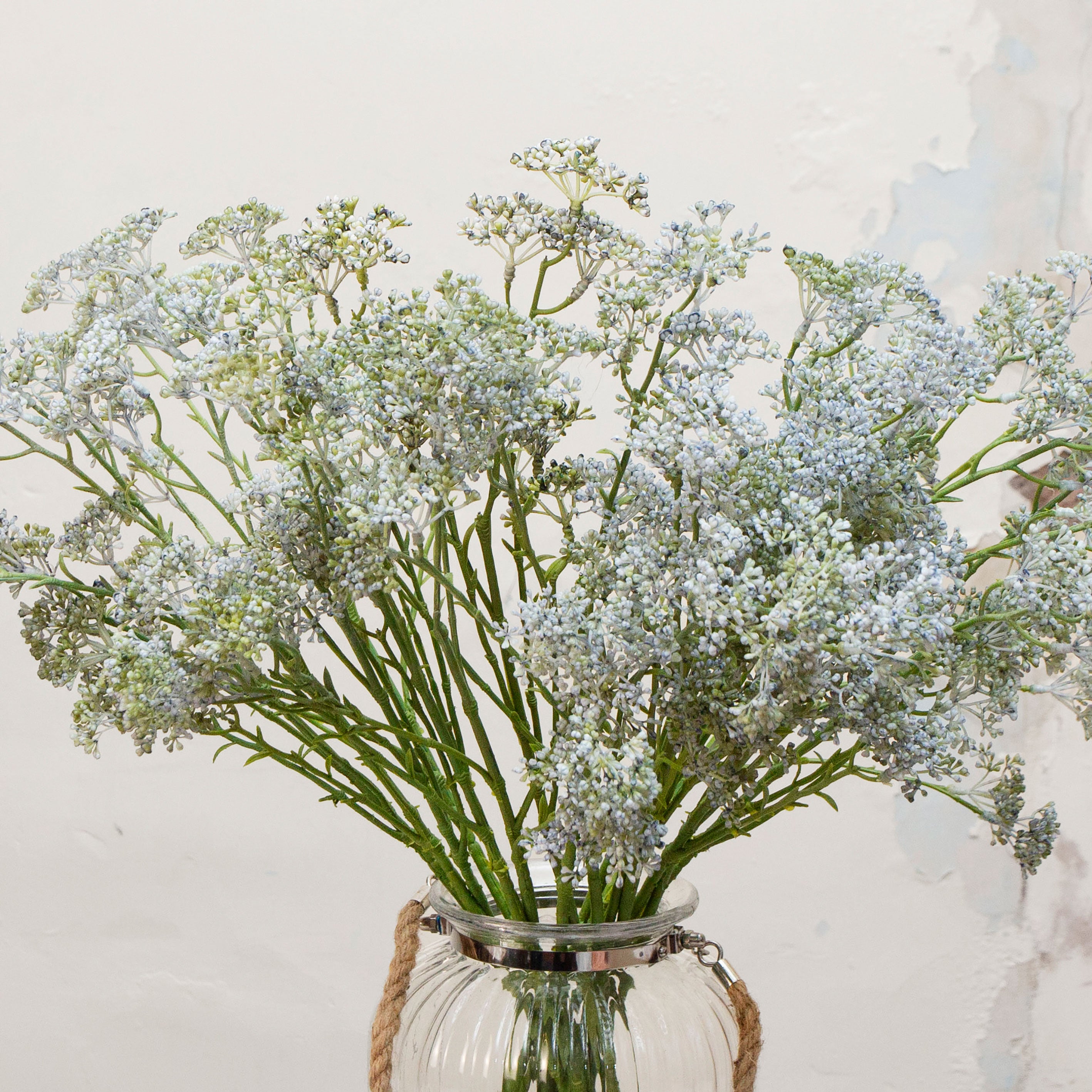 Close-up of artificial soft pale blue patrinia flowers showing fine clustered detail and subtle colour variation