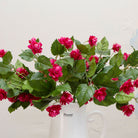 Close-up of artificial fuchsia hop spray flowers showing detailed pink blooms