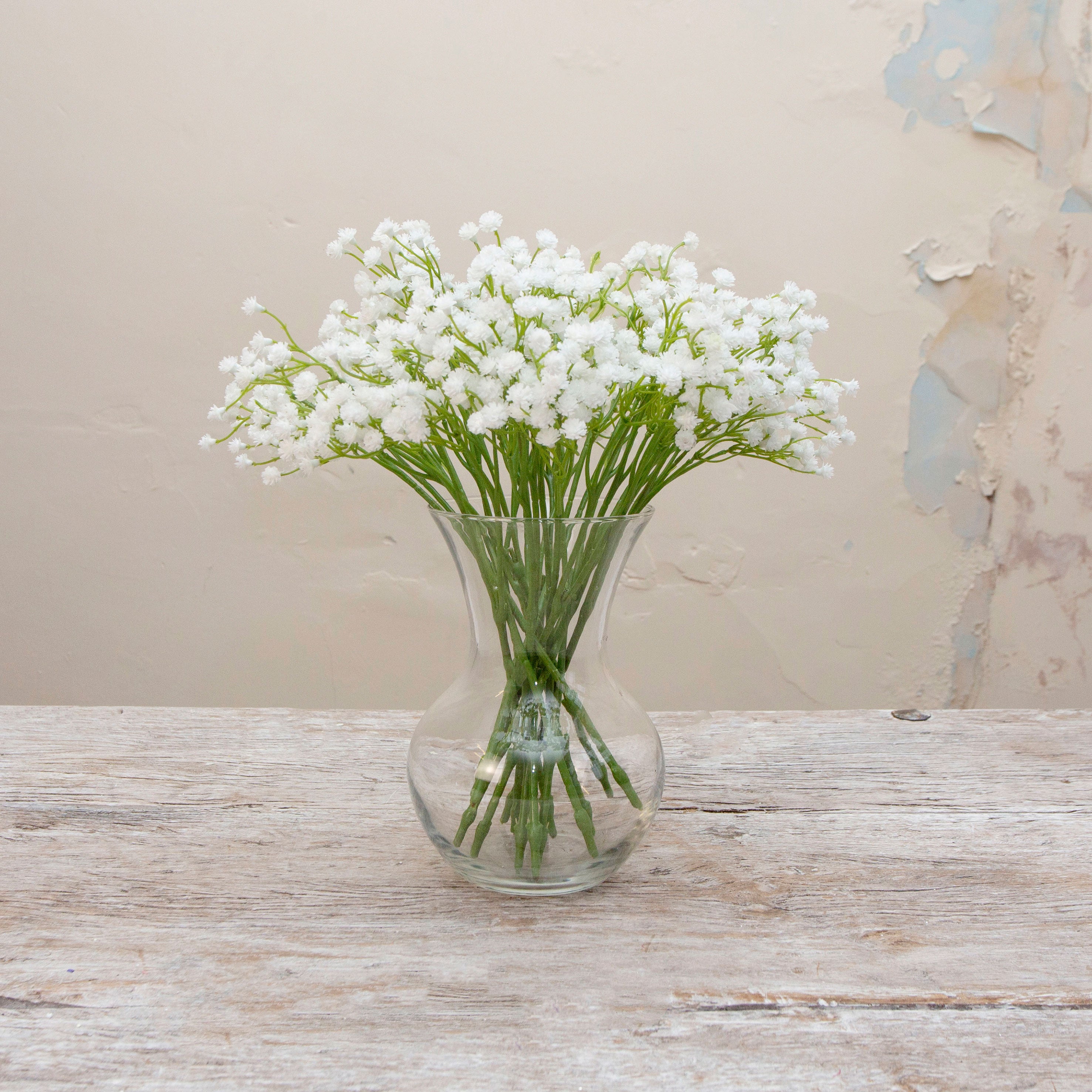 Artificial white gypsophilia pick displayed in vase  