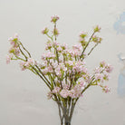 Close-up of artificial pale pink buddleia flowers showing clustered blooms and soft colour detail.