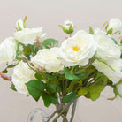 Close up of artificial bridal white old English rose stems