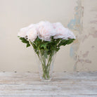 Artificial pale pink open Peony Stems displayed in a glass vase 