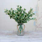 Artificial astilbe stems displayed in vase 