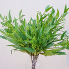 Close up of artificial green eucalyptus stems with seeds 