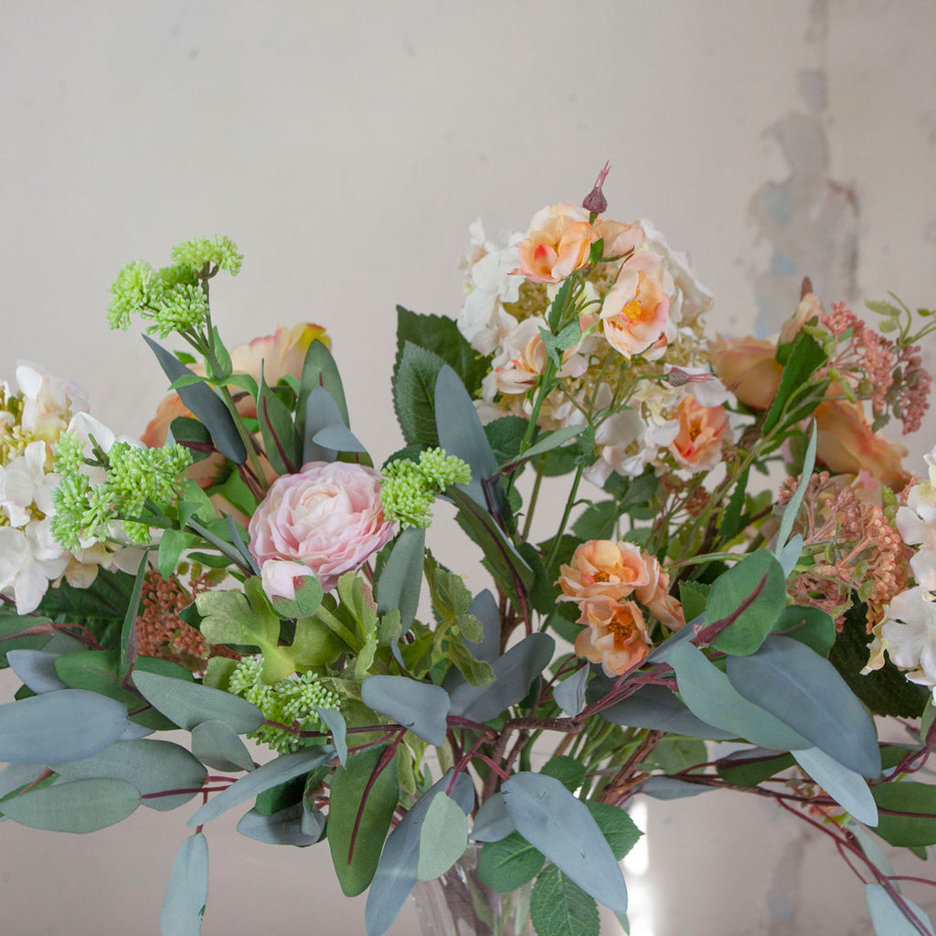Close up of Roses, Hydrangea & Eucalyptus in a Grand Waisted Ridged Vase
