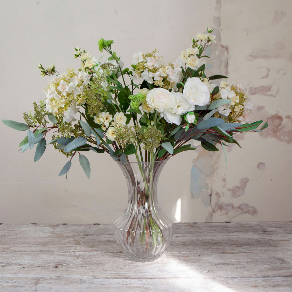 White Roses, Hydrangea & Eucalyptus in a Grand Waisted Ridged Vase
