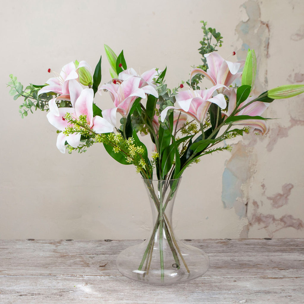 Casablanca Lilies and Foliage in a Decanter Vase