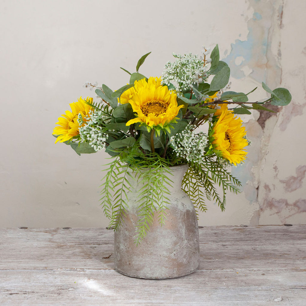 Sunflower and Foliage in a Rustic Urn