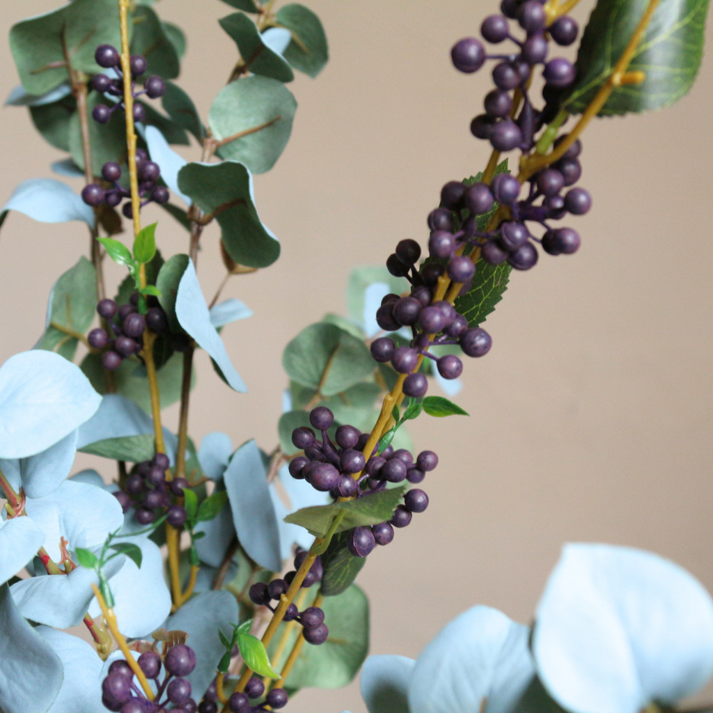 Eucalyptus and Berries in a Tall Lustre Bottle Vase with Rice Lights