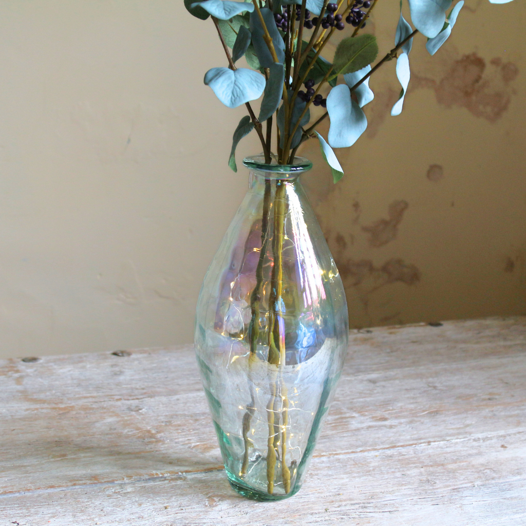 Eucalyptus and Berries in a Tall Lustre Bottle Vase with Rice Lights