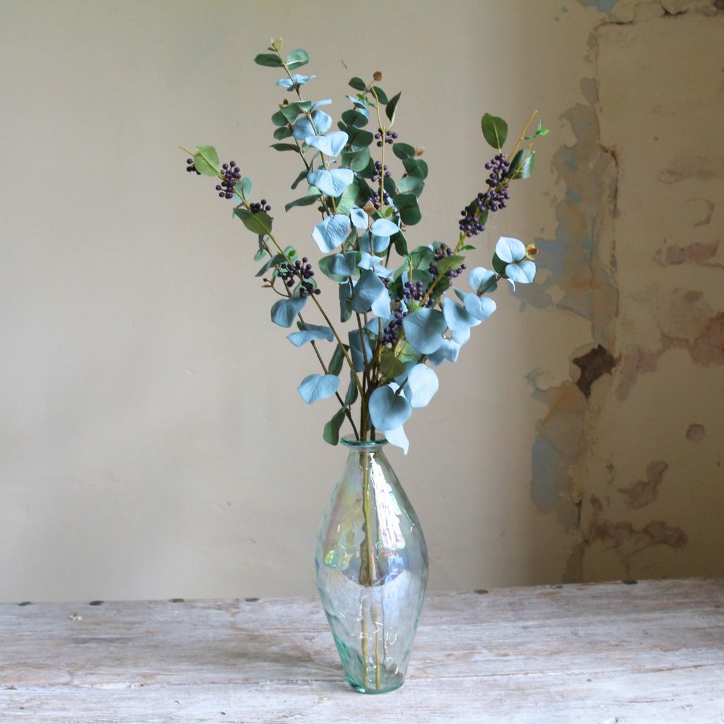 Eucalyptus and Berries in a Tall Lustre Bottle Vase with Rice Lights