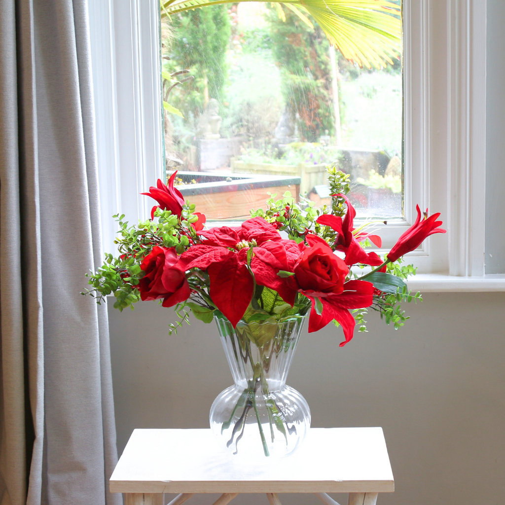 Roses, Lilies and Poinsettia in an Optic Vase Lifestyle
