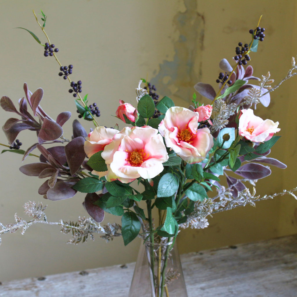 Pale Pink Dogwood Roses and Berries with Autumn Lambs Leaf in a Glass Vase close up