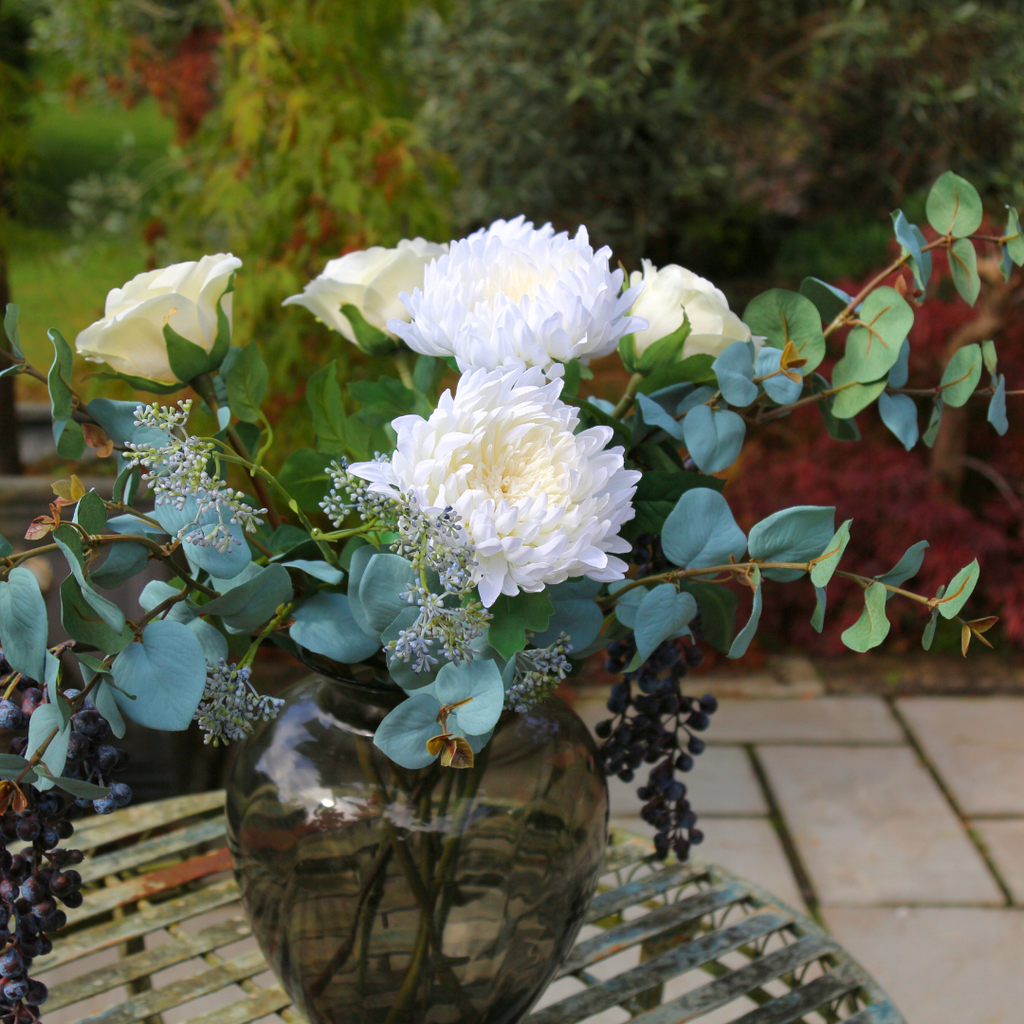 Chrysanthemum, Rose and Patrinia in a Smoked Rigged Vase Outdoor Closeup