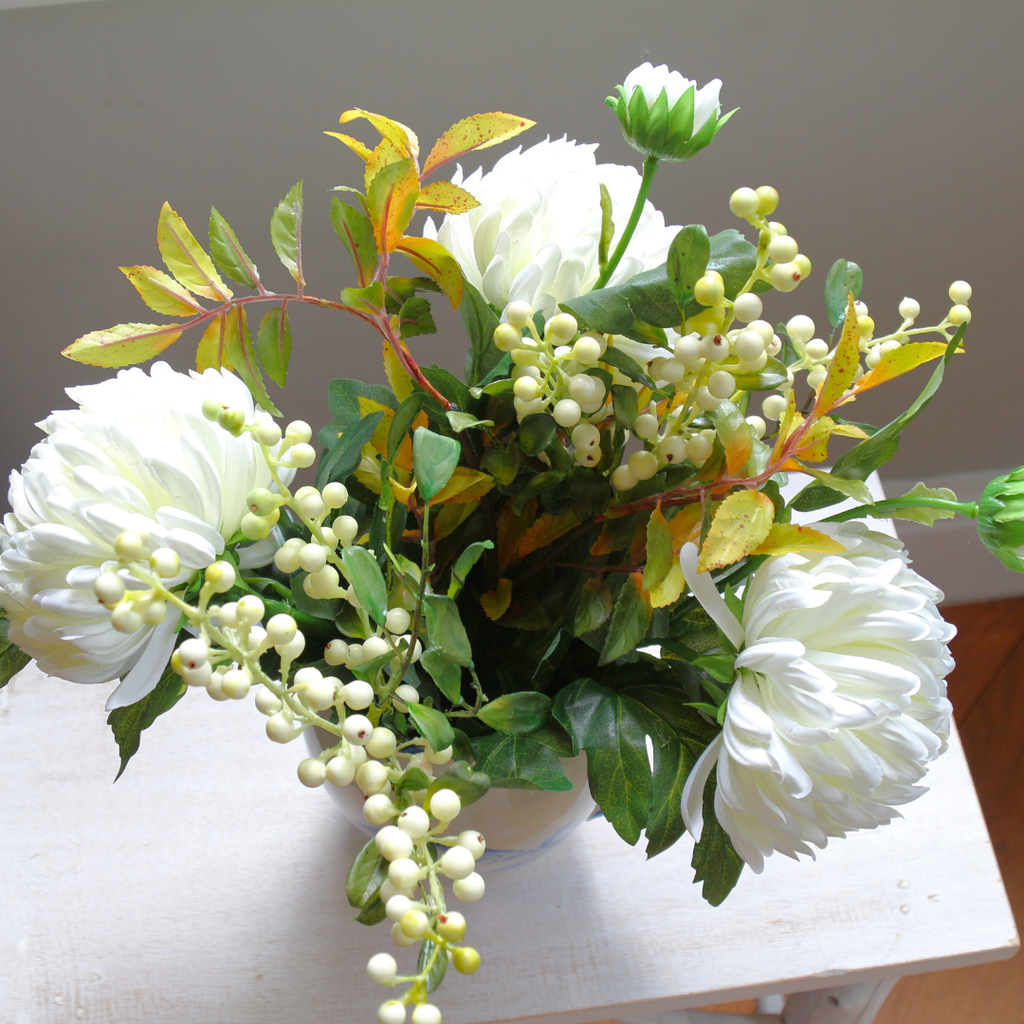 Blue and White Jug with Bridal White Chrysanthemums, Snowberries and Foliage Lifestyle Close up 