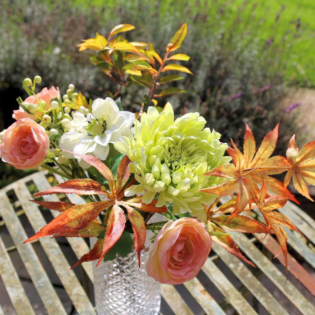 Autumn Mix of Flowers and Foliage in a Pretty Textured Glass Vase Outside Close up3