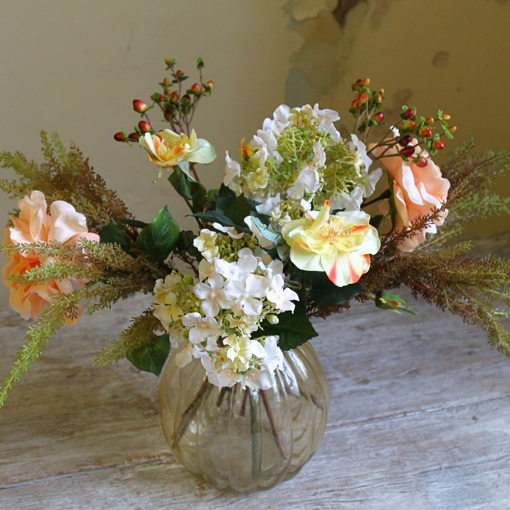 Autumn Mix with Roses, Berries and Hydrangeas in a Amber Pumpkin Vase Close up2