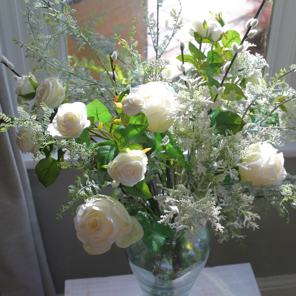 Array of Autumn Blooms, Roses and Pussy Willow in a Glass Vase Lifestyle Close up