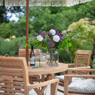 Hampton Vase styled with fresh bouquet on outdoor patio dining table.