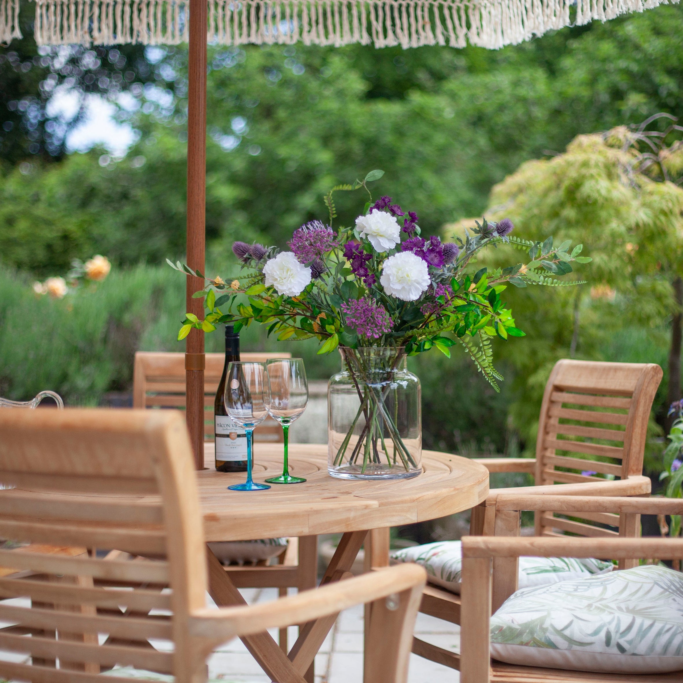 Hampton Vase styled with fresh bouquet on outdoor patio dining table.