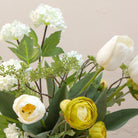Artificial tulip and ranunculus flower arrangement in a rustic Roman style pot