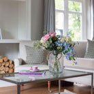 Artificial Country cottage style roses and hydrangea arrangement in a glass rope lantern vase