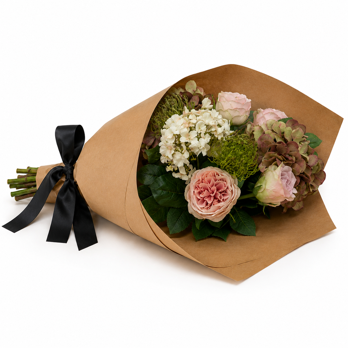 Artificial hydrangea, rose and chrysanthemum bouquet in soft pink, white and green tones, wrapped in brown kraft paper with a black satin ribbon.
