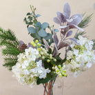 Close up of Artificial Seeded Hydrangea, Berries & Pine Cone Bouquet with white hydrangea blooms, green berries, eucalyptus, pine foliage and natural pine cone accents 