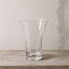 Clear glass chime vase with a gently flared shape and wide rim.